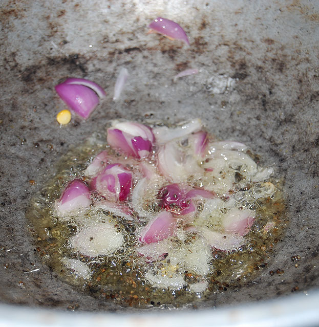 Heat oil, add mustard, bengal gram, urad dal & onion