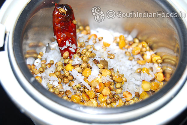 Add roasted ingredients in a mixie jar coarsely grind