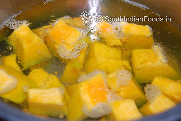Cut yellow pumpkin in to cubes. Heat water in a pan& let it boil. Then add cubed pumpkin