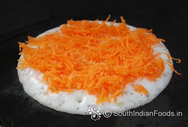 Add grated carrot & pour another 1 tbsp of oil over the carrot