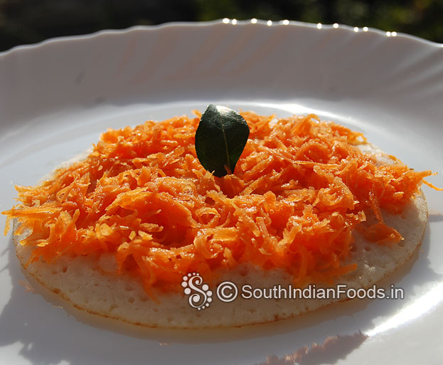 Uthappam dosa with grated carrot toppings is ready, serve hot with green chutney