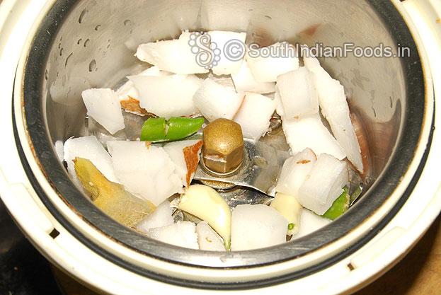 Add coconut, ginger, garlic & green chilli in a mixer jar