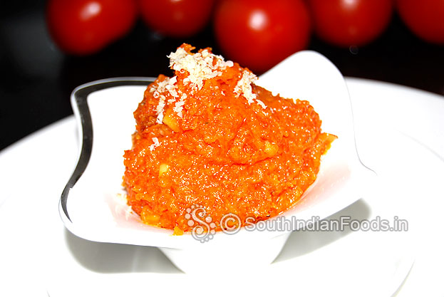Transfer halwa to a serving bowl & garnish with grated almonds then serve hot or chilled