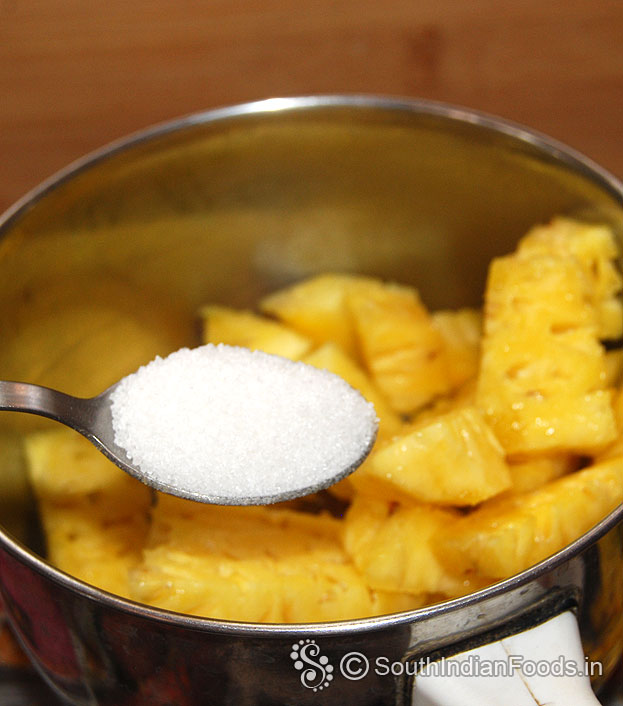 In a mixie jar, add pineapple cubes, sugar