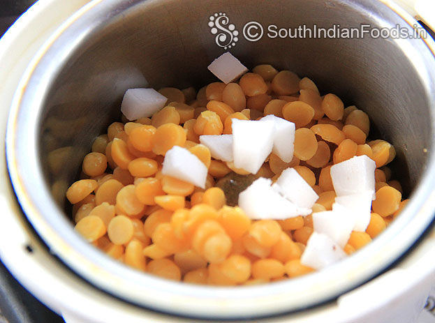 Put boiled bengal gram and coconut in a mixer jar & coarsely grind