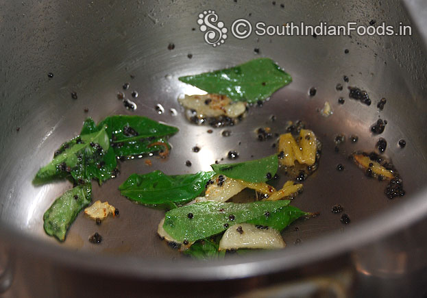 Heat oil, add mustard, garlic, ginger, curry leaves
