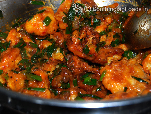 Gobi manchurian is ready, sprinkle spring onion, cut off heat, serve hot with fried rice