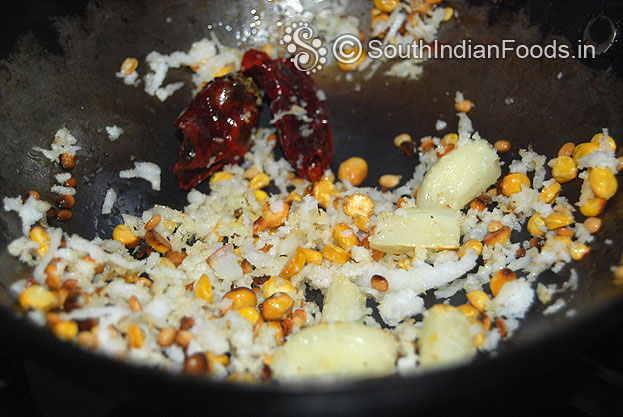 Add garlic, dry red chilli, coconut saute