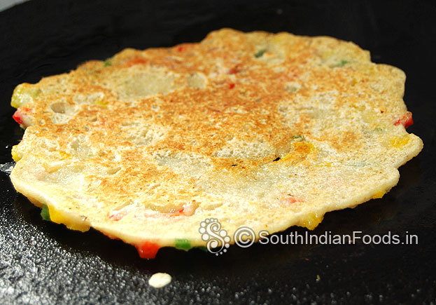 Perfectly cooked oats dosa, remove from pan, serve hot with coconut chutney