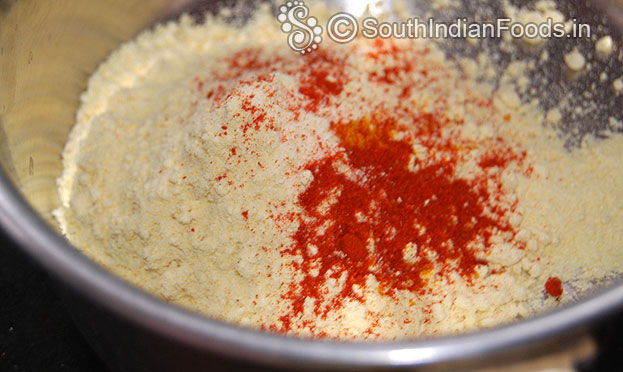 Add gram flour, salt, turmeric, red chilli powder in a bowl mix well