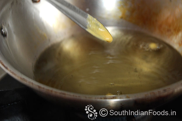 Heat oil in a pan take batter in a spoon check consistency