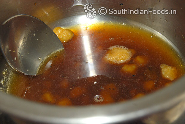Heat jaggery ,water, let it boil for 5 min or till sticky consistency syrup