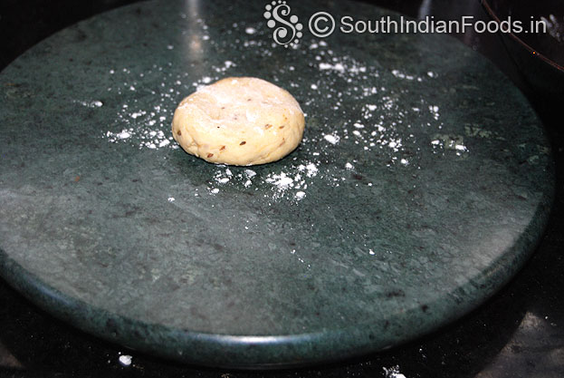 Sprinkle flour, roll out into thin chapathi