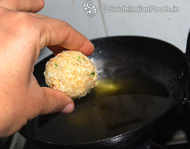 Heat oil in a pan, drop prepared balls in oil