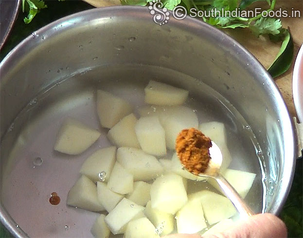 Boil potato with red chilli & turmeric powder