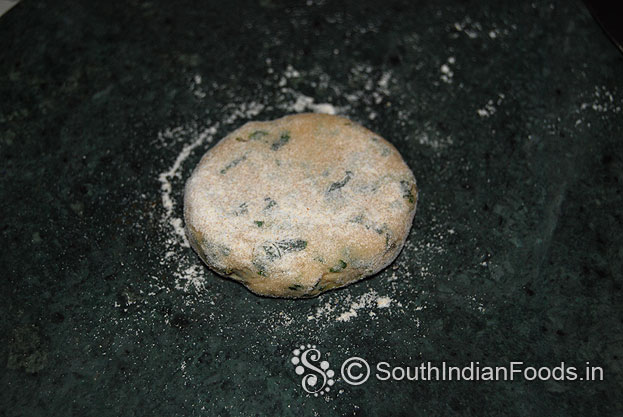 Sprinkle flour over the ball, flatten, roll out into thin chapati