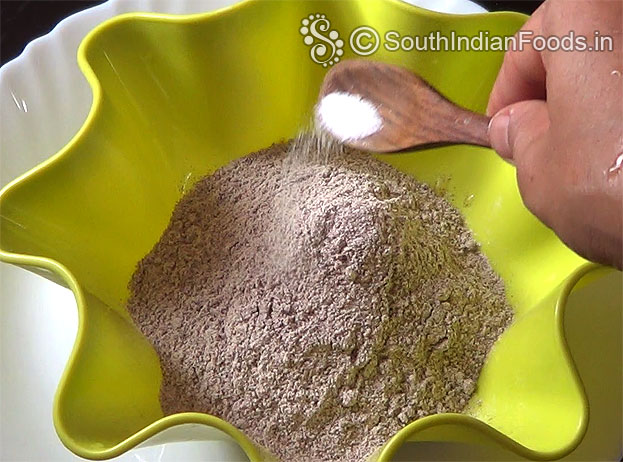 In a bowl, add ragi flour, & salt 