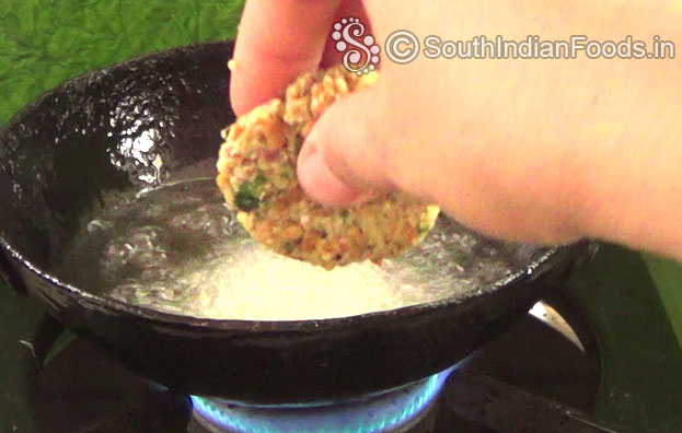 Heat enough oil in a pan, put raw cowpea vada