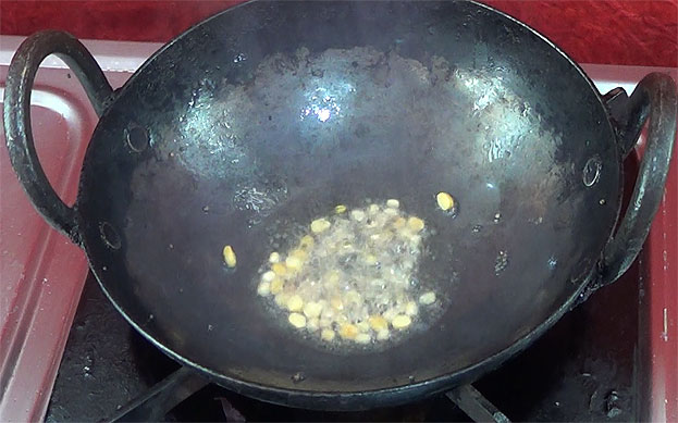 Heat pan, add oil, chana dal, urad dal fry till light brown