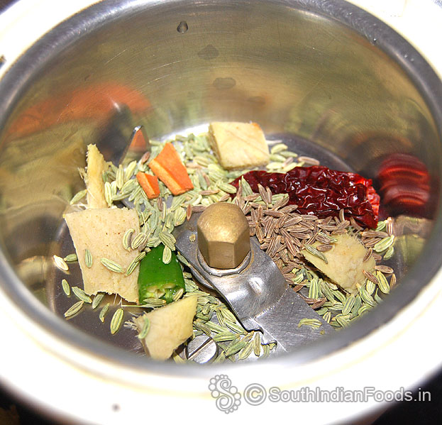 In a mixie jar, add cumin, fennel, cinnamon, ginger, green chilli, dry red chilli