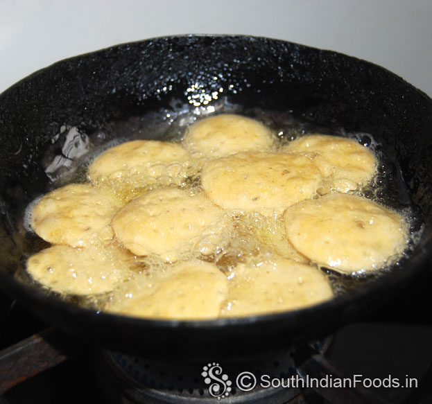 Heat enough oil in a pan, drop raw papdi