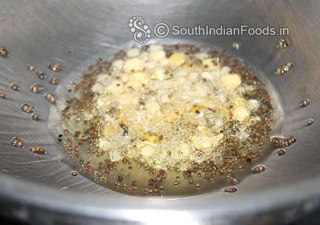 Heat oil in a pan add mustard seeds, bengal gram, urad dal