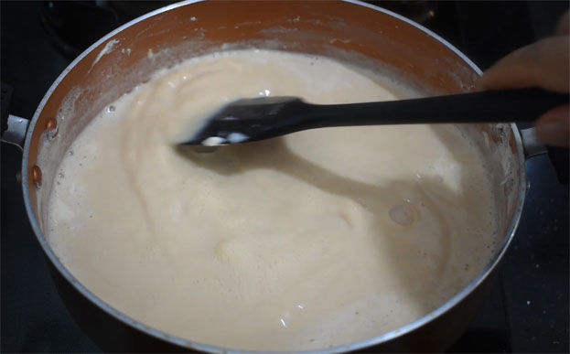 In a bowl add curd, cardamom, sugar