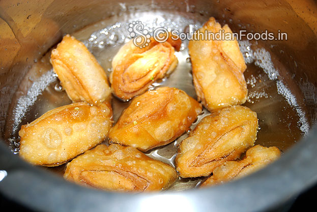 Place fried kaja pieces to the sugar syrup & leave it for 2 to 3 min