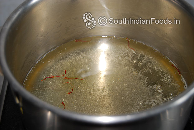 Add saffron let it boil till half string consistency