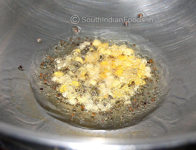 Heat pan with oil, add mustard, bengal gram, urad dal