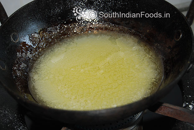 Heat pan add oil and ghee for deep frying