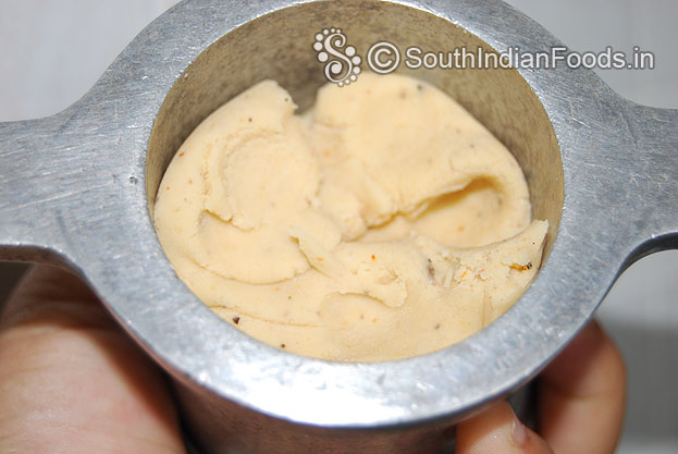 Place mold & Put one handful dough in to a muruku kuzhal