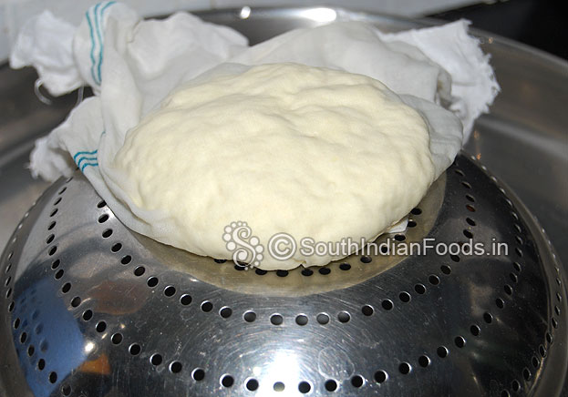 Place large plate then place upside down vegetable filter then place paneer & press gently