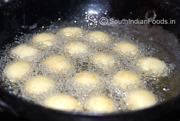 Heat oil, add potato paneer stuffed balls