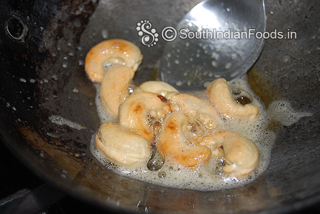 Heat ghee in a pan roast cashew nuts till golden brown