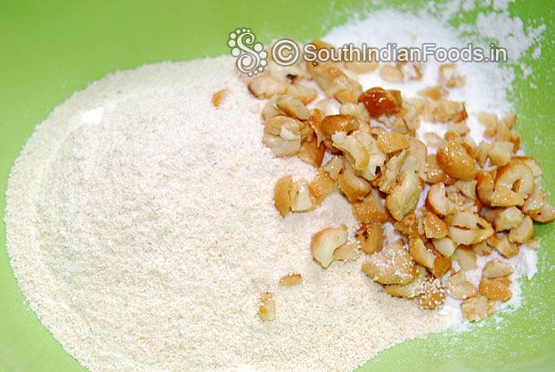 In a bowl add ground rava, sugar cardamom mixture & cashew nuts mix well