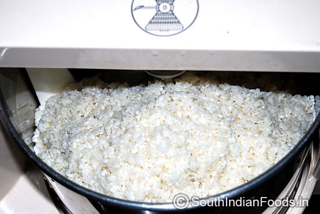 Add idli rice in a grinder and grind to fine batter