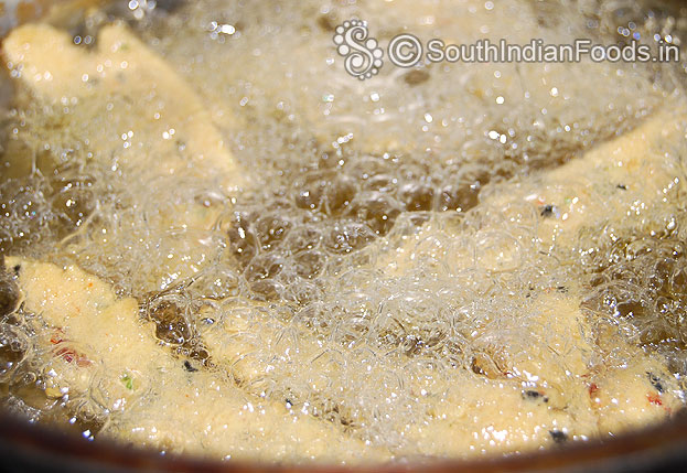 Heat enough oil in a pan, squeeze over the oil, deep fry till crisp and light brown on medium hot oil