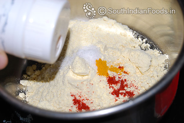 Add gram flour, asafetida, salt, turmeric & red chilli powder mix well