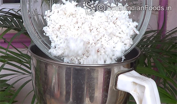 Add grated coconut in a mixie jar