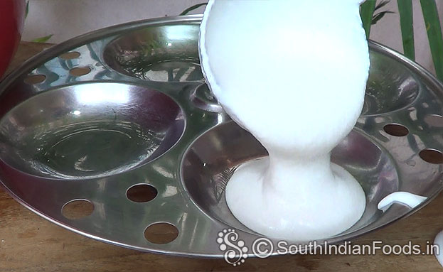 Pour ground batter to idli plates
