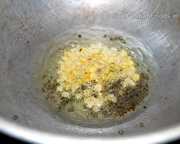 Heat pan, add oil, mustard, bengal gram and urad dal