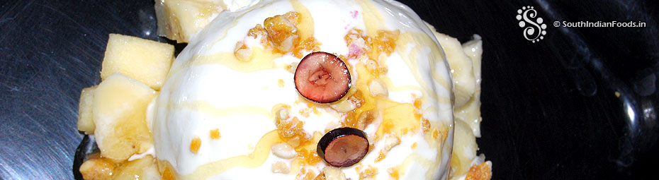 Vanilla ice cream with fruits and crispy peanut topping