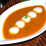 Mini idli in tomato curry