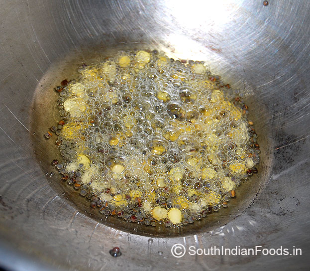 Add mustard, bengal gram, urad dal