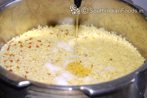 Add salt and gingelly oil to the panivaragu mixture