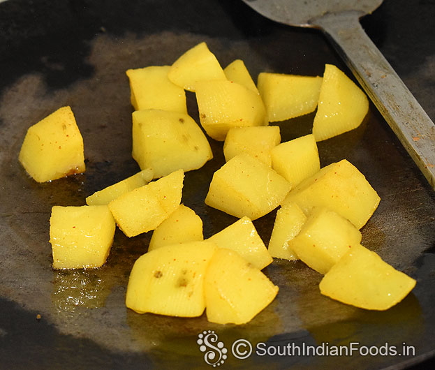 Heat iron dosa tawa, add potato cubes, saute till crisp