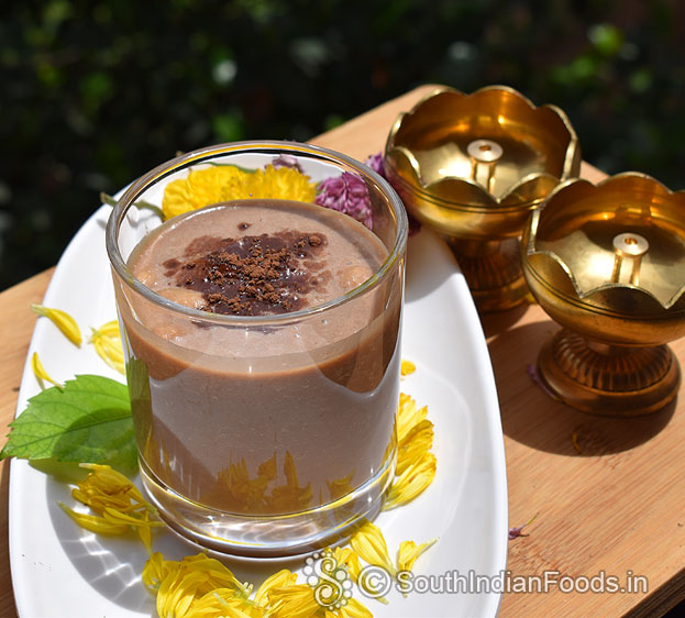 Apple cocoa powder milkshake ready, serve with ice cubes