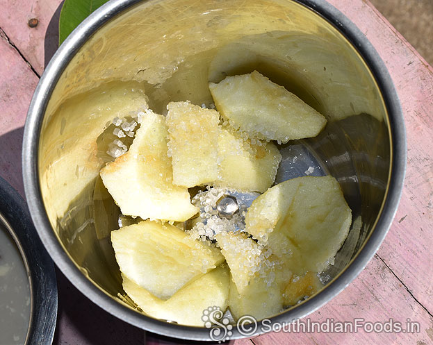 In a blender add apple, sugar