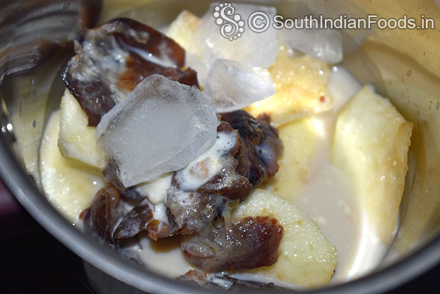 In a blender add apple , ice cubes